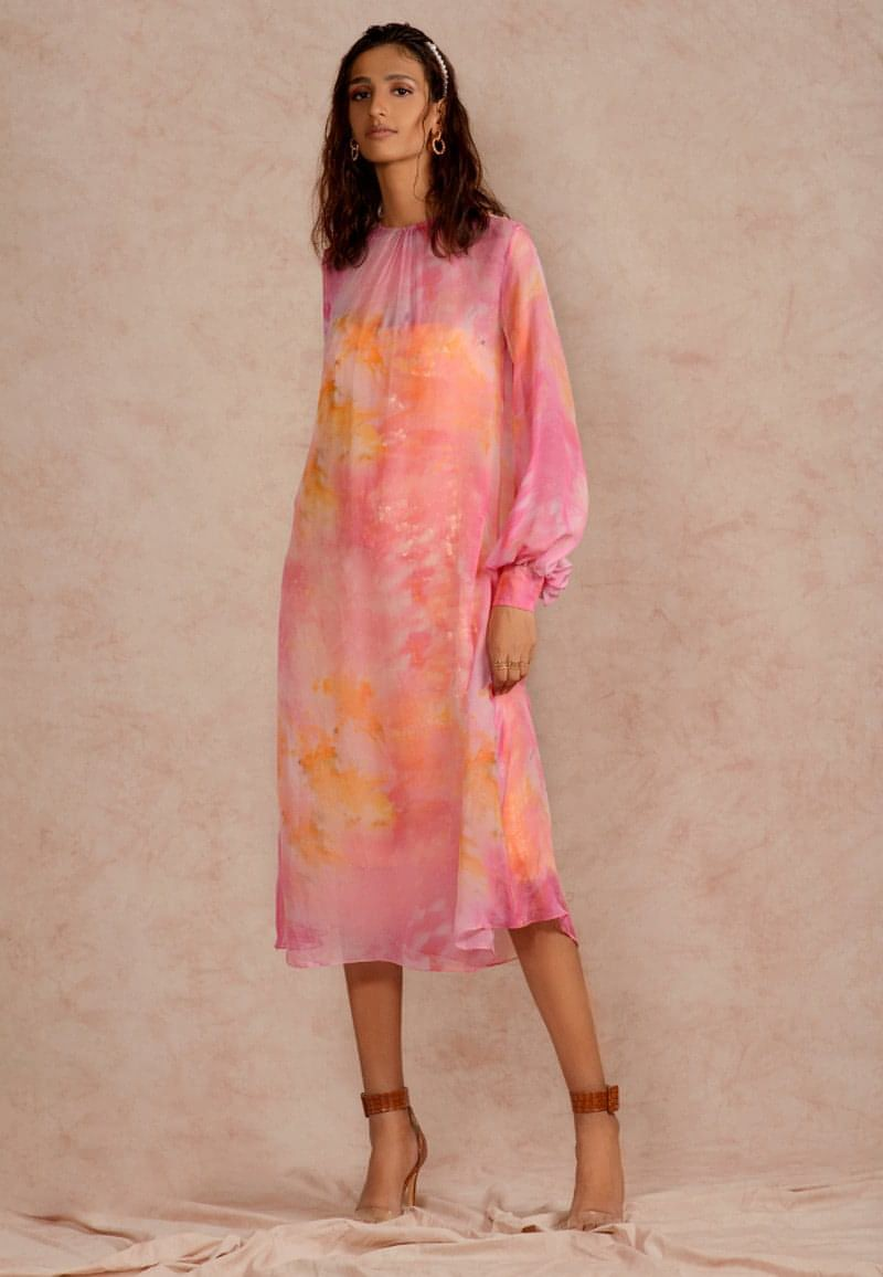This pink and yellow sheer dye print midi dress with a sequin dress underneath can be styled in multiple ways. Made in chiffon and crepe this ensemble with handcrafted bandeau is perfect for the next date or formal evenings. Wear the piece in summer or style it in winter with an overlap jacket and stylish boots