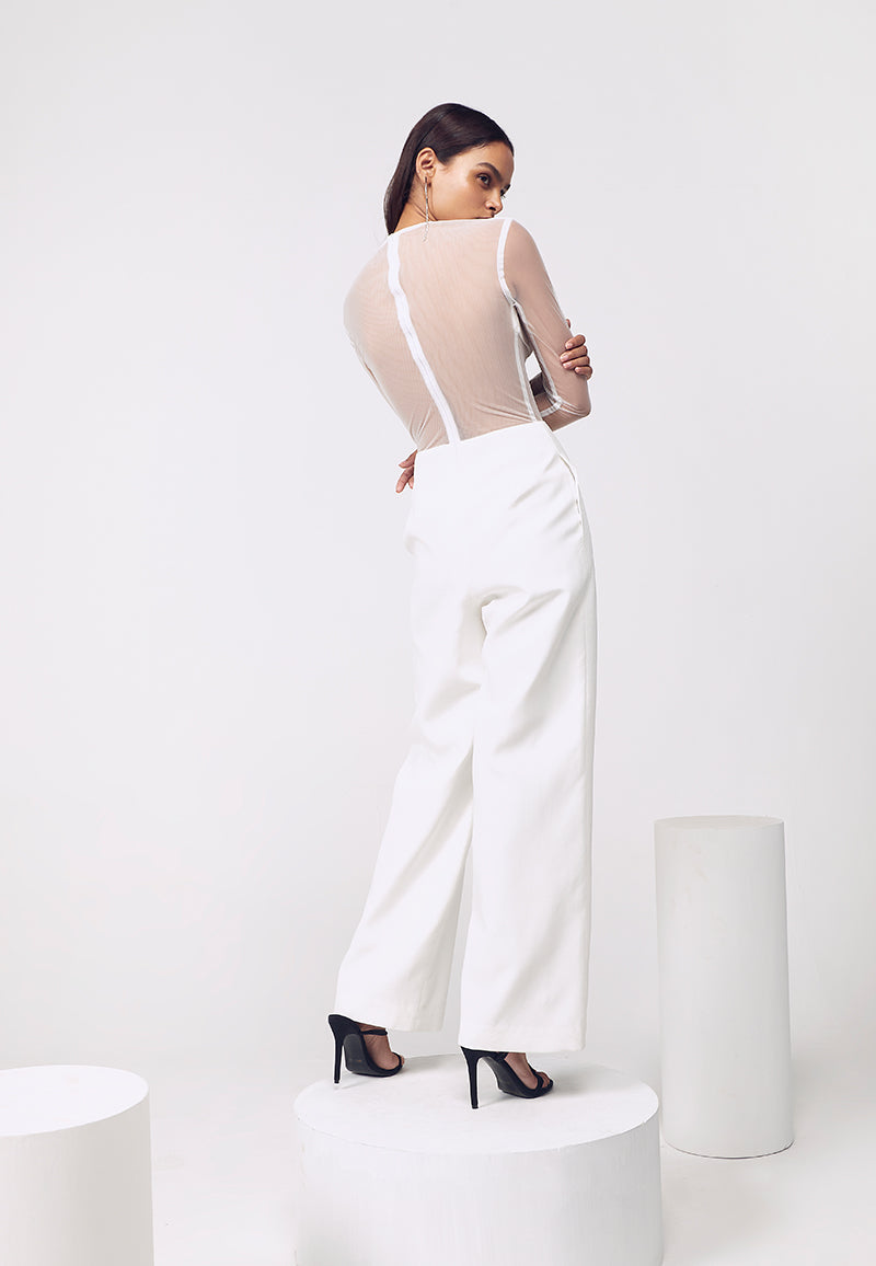 This beautiful bodycon white jumpsuit crafted from pure silk crepe features vertical hand-pleated details on the front. The boning detail on waist and a sultry sheer back made out of net adds a unique look to the ensemble. The straight pants falls to the floor from high-waist. Style it in the summers with heeled sandals or in the winters with pumps for added glamour.