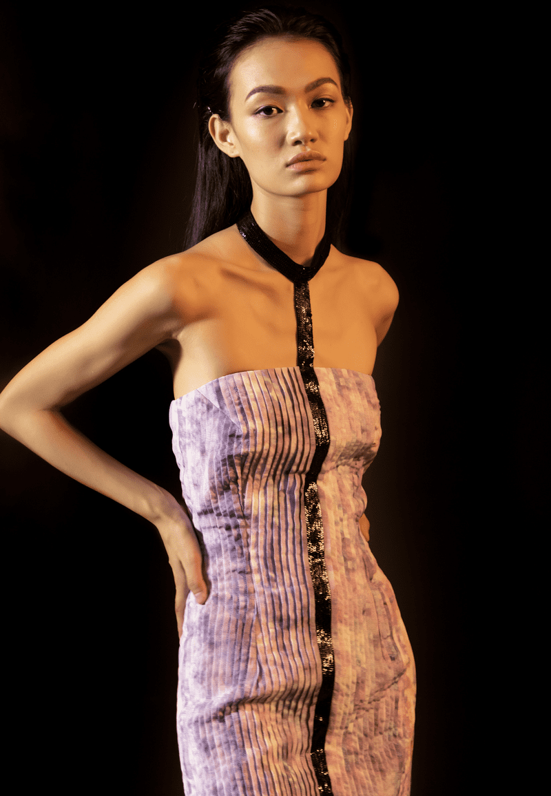 Make a statement in this womens embellished bandeau choker mini dress that is cut from lustrous silk and embellished with black sequins. The hand-pleated details and tie dye print add glamour and depth to the ensemble. Pair it with high heels for a date night.