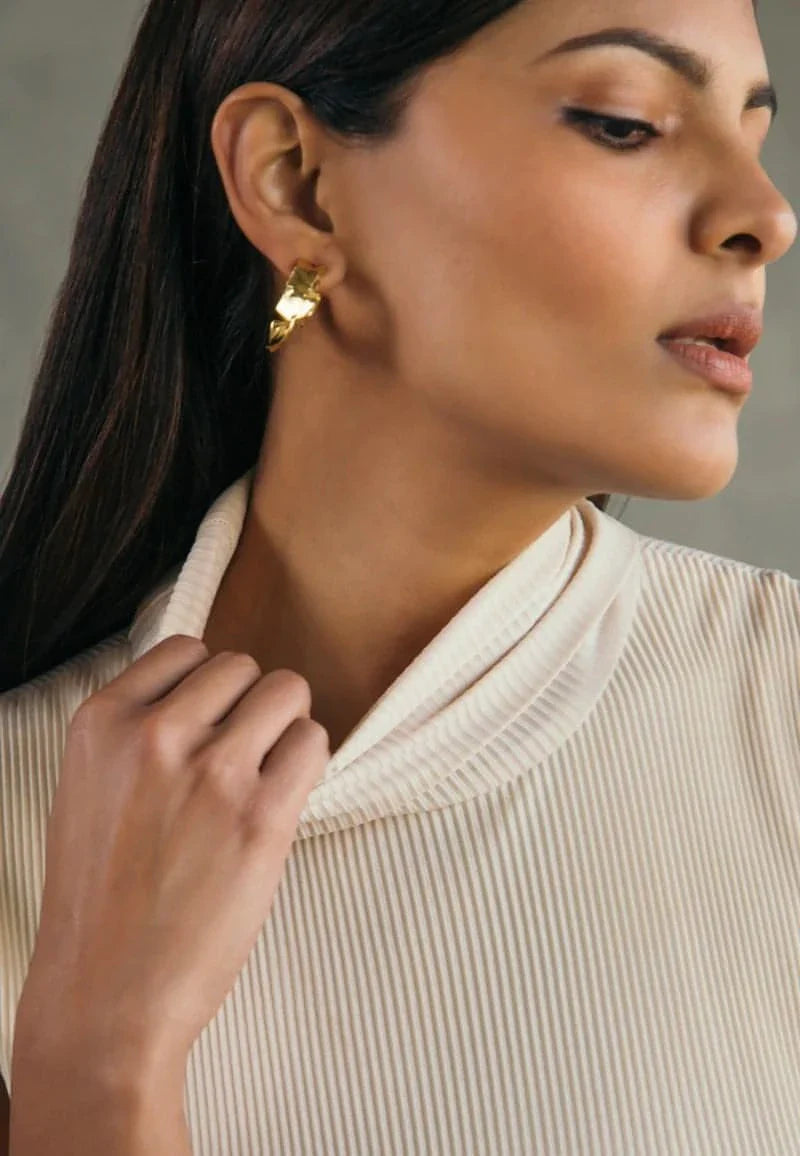 This high-neck bodycon midi dress in beige is crafted in pre-pleated jersey knit fabric. Must-have for any season (summer, spring, fall and winter), this ensemble has a bodycon fit and has a snug turtleneck. Wear the piece with flat sandals or sneakers for an everyday look/work or switch to booties or heels for a night out with friends. Pair it with gold accessories for an elevated look.